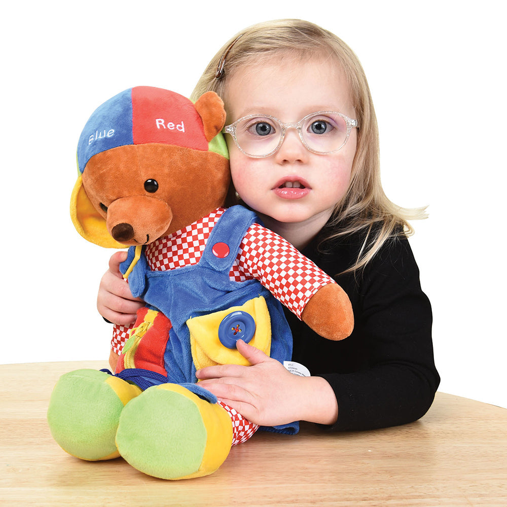 Child Posing with Learn & Play Teddy Bear