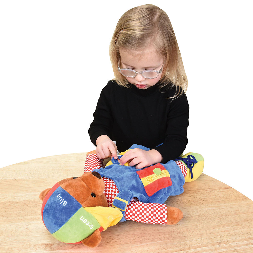 Child Exploring Buttons on Learn & Play Teddy