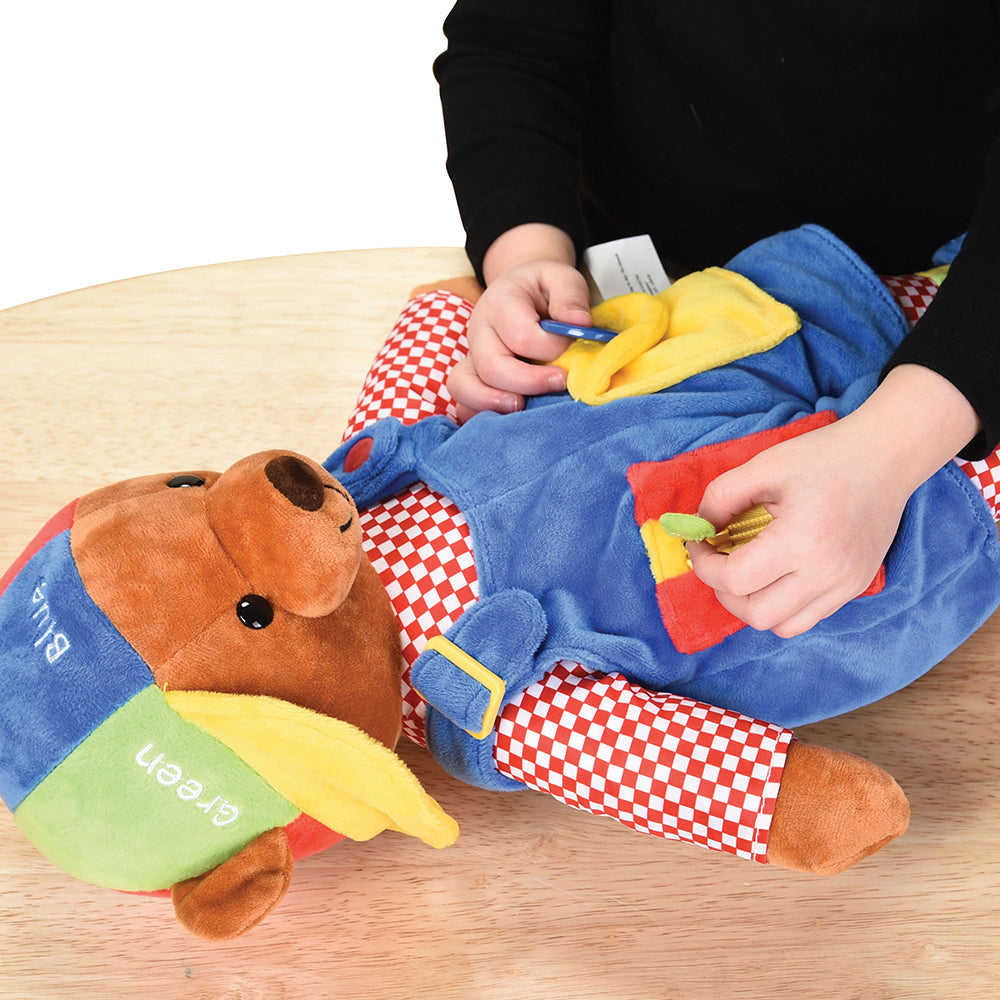 Child Examining Buttons & Zippers on Learn & Play Teddy