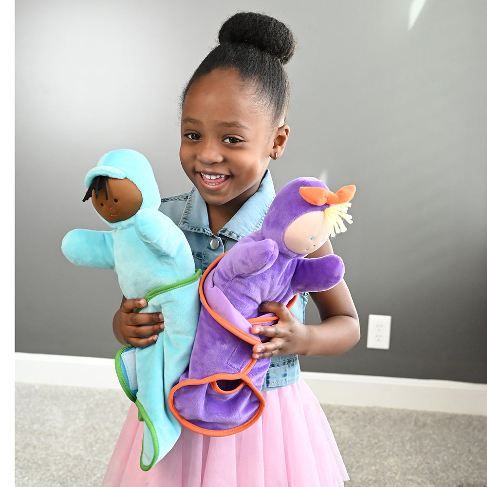 Child Engaging with Swaddle Baby Dolls