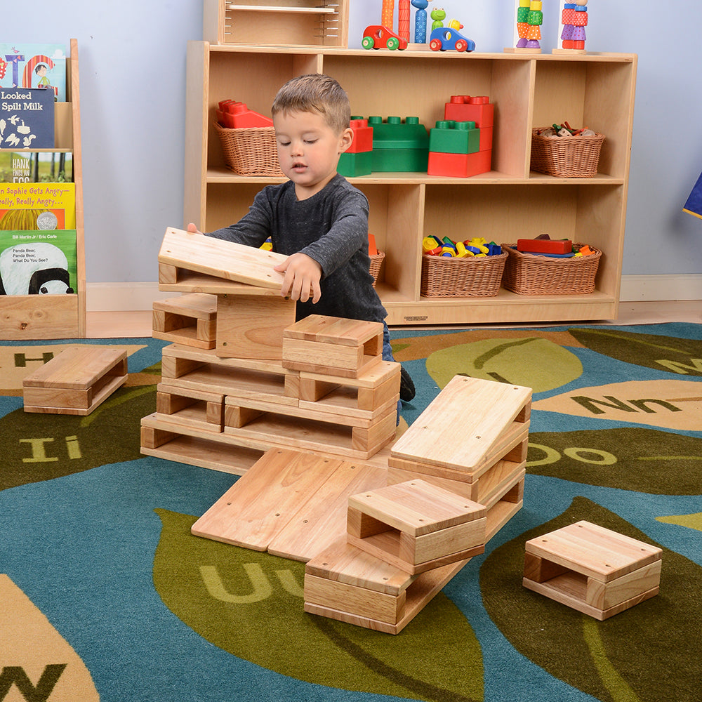 Kid Stacking Junior Hardwood Hollow Blocks in the Classroom
