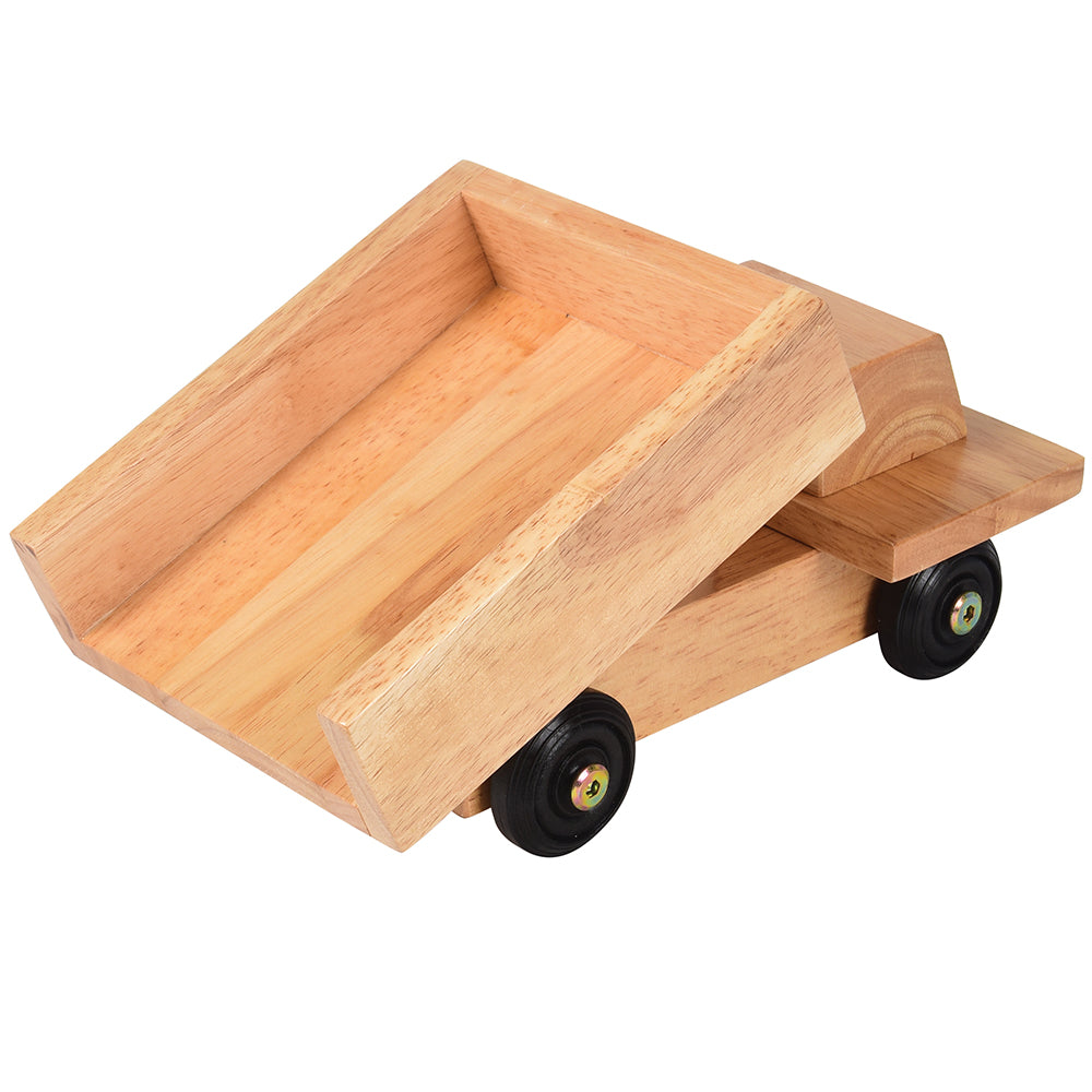 A wooden dump truck toy with rubber wheels and steel axles, constructed of light-colored hardwood.