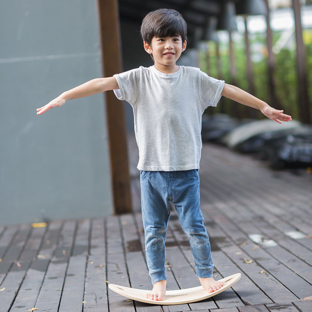 Kid Balancing on Wooden Board