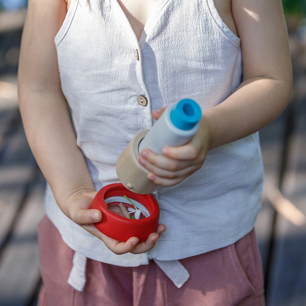 Kid Putting Wooden Kaleidoscope Together