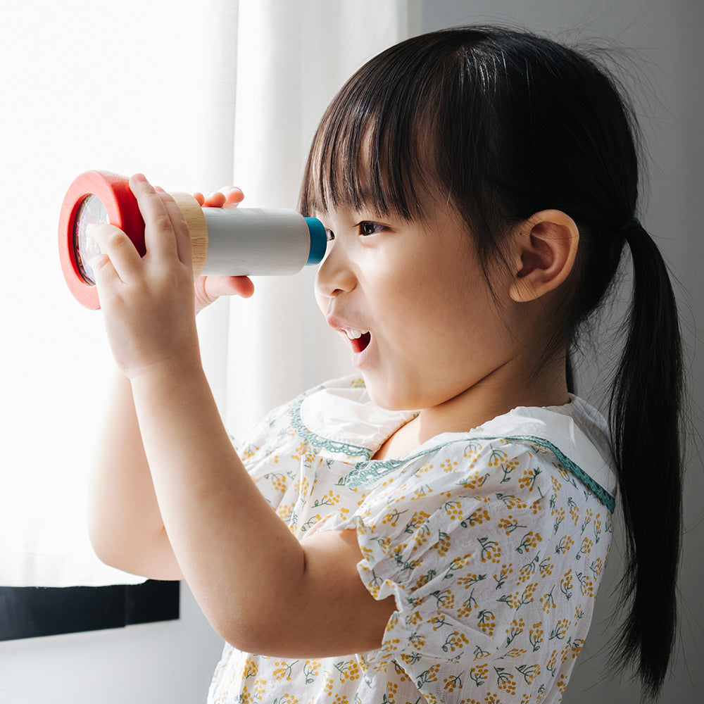 Kid Amazed At What They See Thru Kaleidoscope