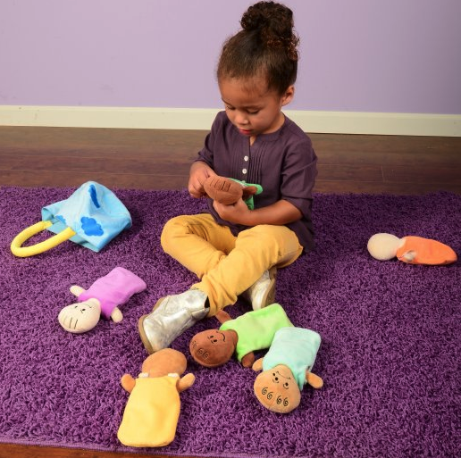 Kid Playing with Expression Baby Dolls