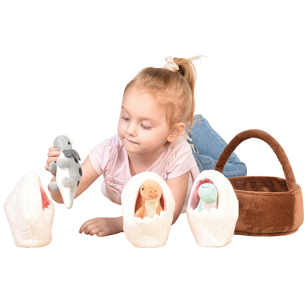 Kid Engaging With Plush Basket of Dinos