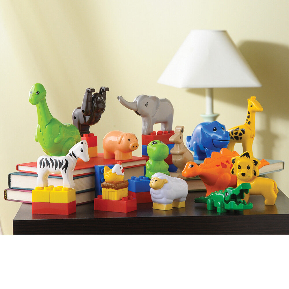 Animals for Building Bricks displayed on table with books and lamp