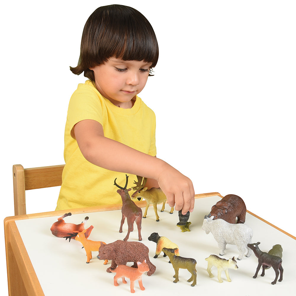 Child Playing with Forest Animals Playset
