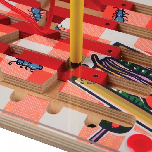 Close-up of Wand Moving Magnetic Ball Through Maze