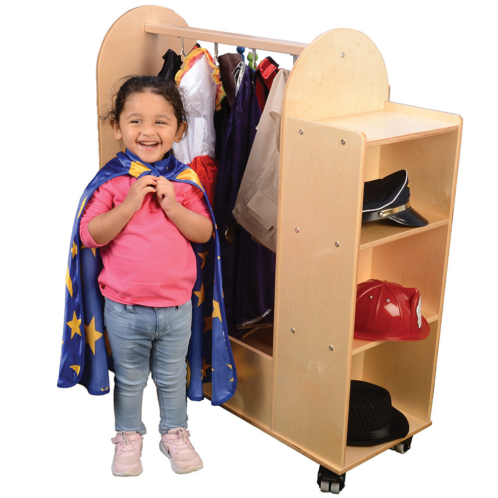 Child Posing with Cape in Front of Dress-up Cart