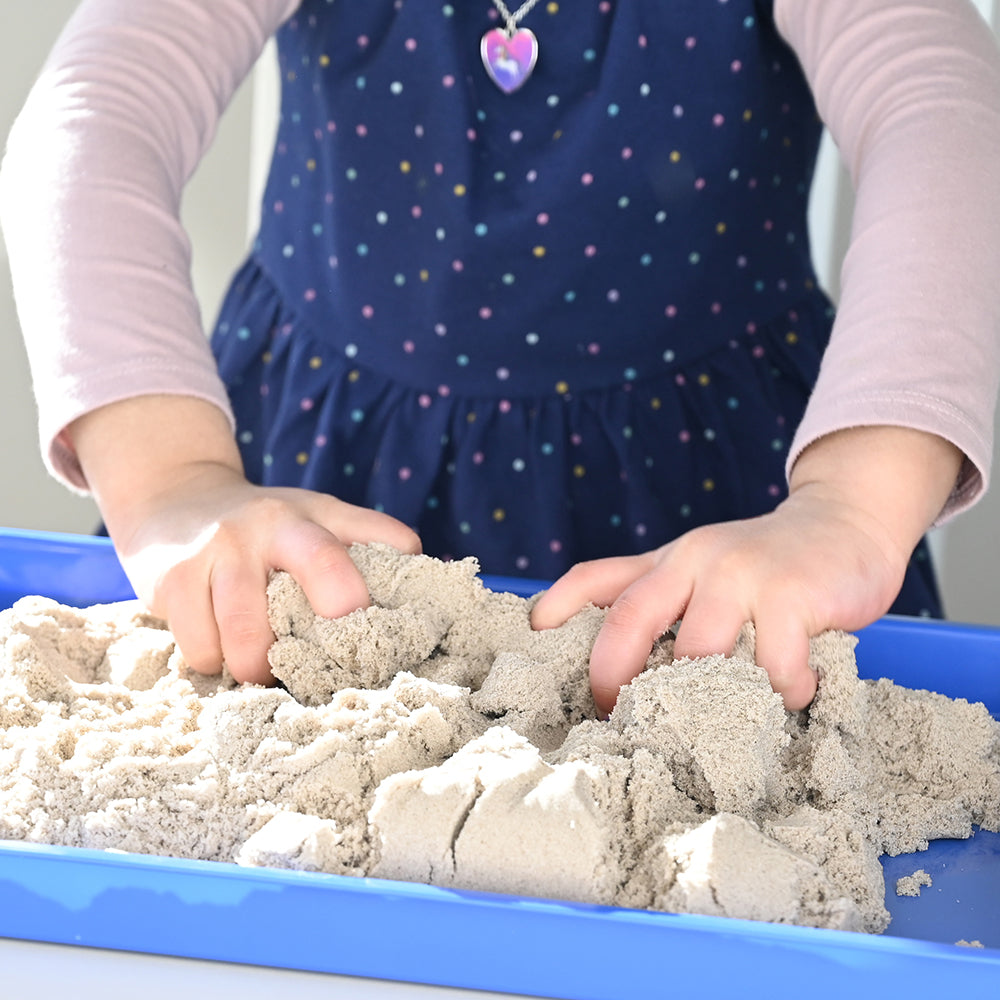 Kid Squishing Tactile Kinetic Sand
