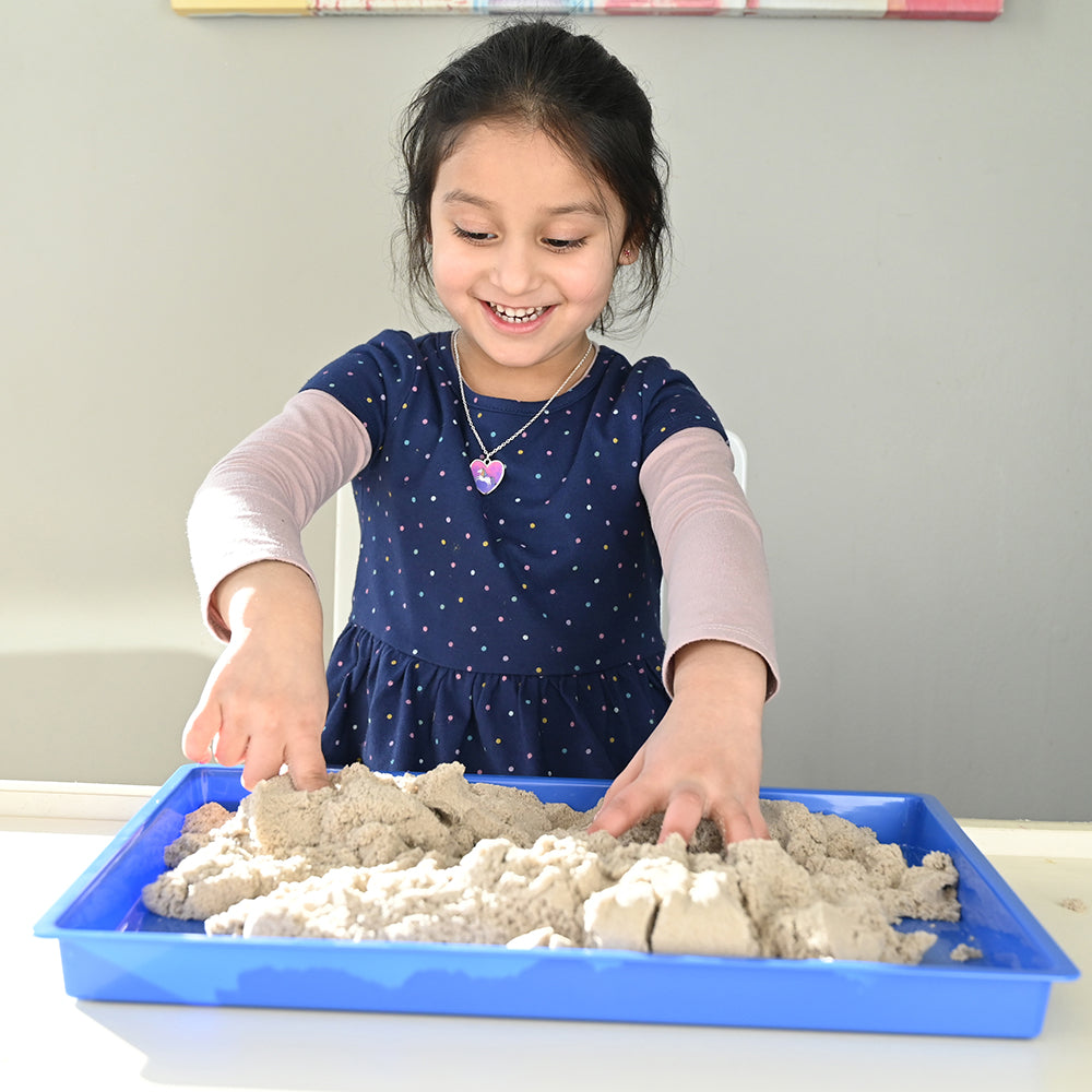 Kid Exploring Kinetic Sand