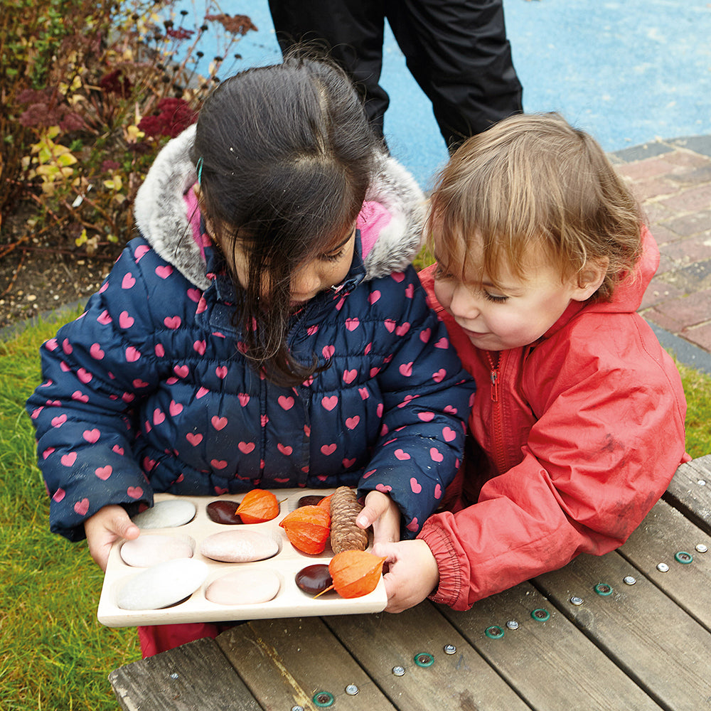 Kids Sorting Bits of Nature on Wooden Tray