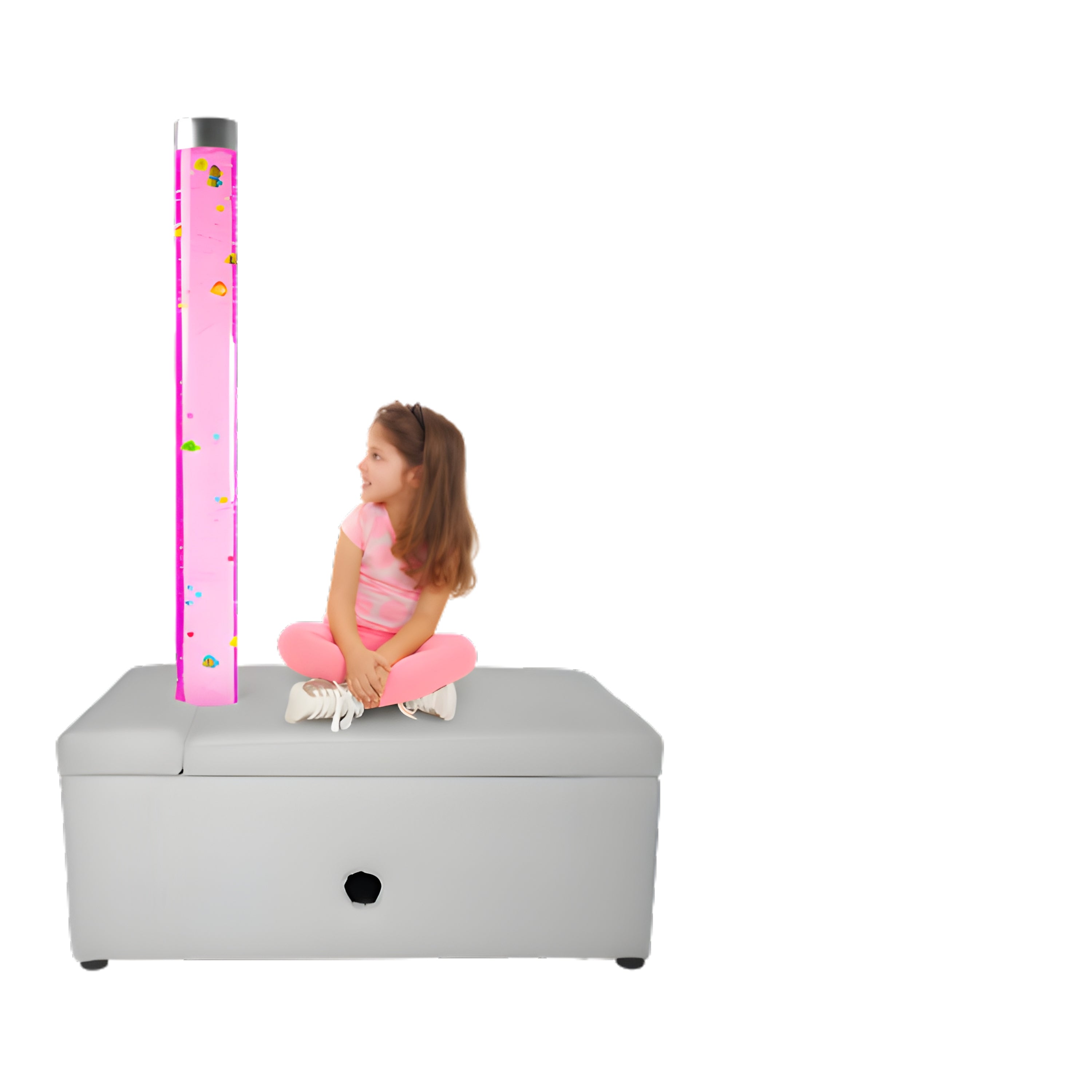 Child sitting on a gray ottoman with a pink bubble tube light next to them on a white background