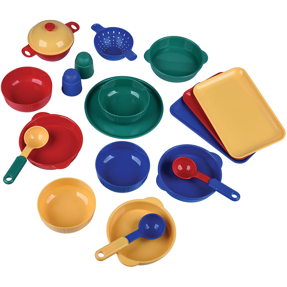 Colorful set of toy kitchen utensils and dishes on a white background