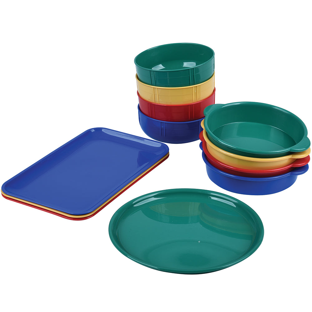 Set of colorful plastic dishes including bowls and a tray on a white background
