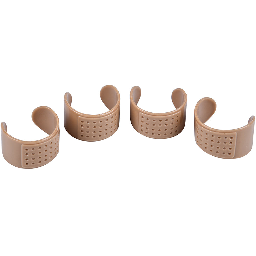 Four beige silicone wristbands with holes on a white background