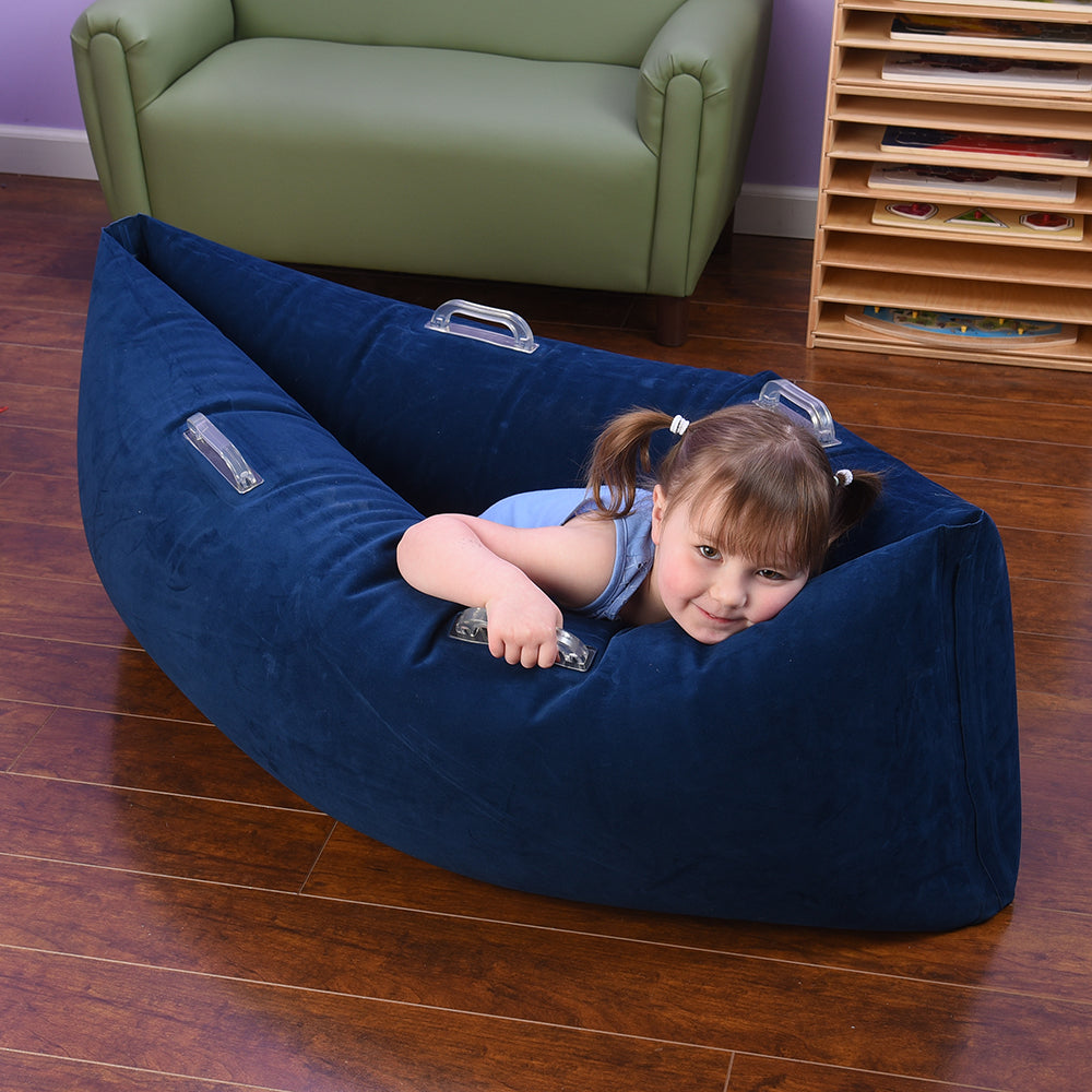 Child Getting Comfortable in Comfy Hugging Peapod for the Classroom