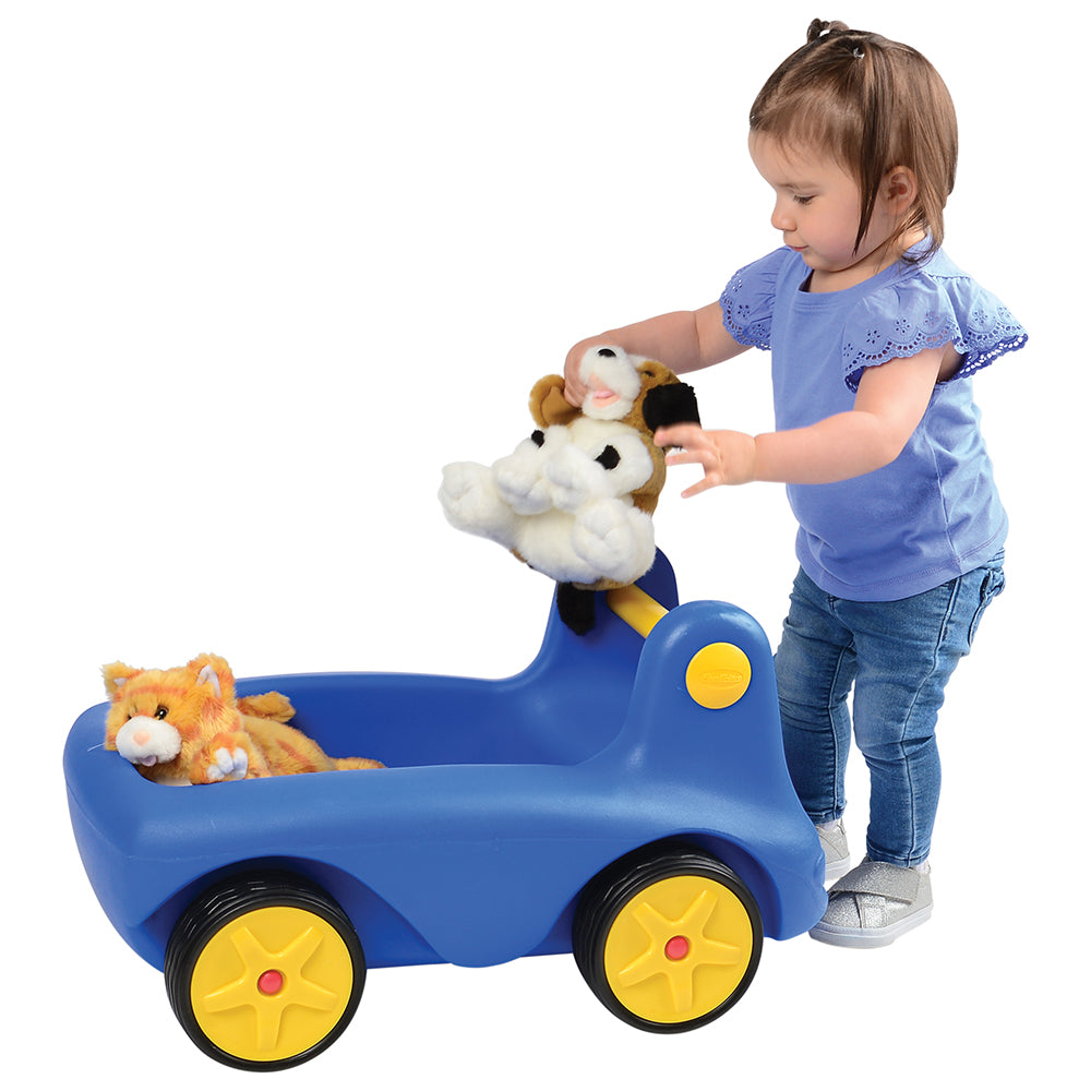 Toddler Adding Stuffed Animals to Big Blue Wagon