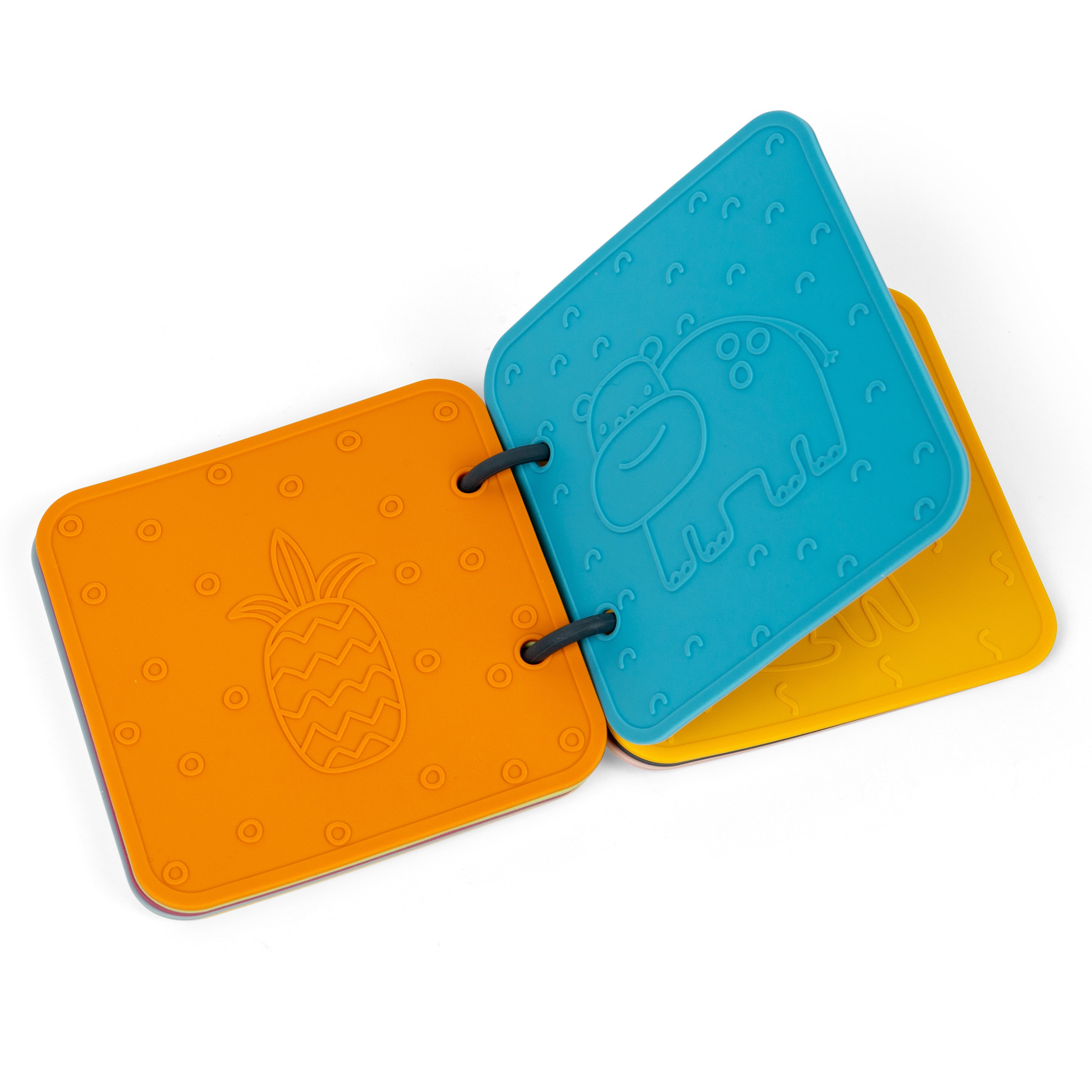 Three colorful silicone book pages with embossed designs on a white background