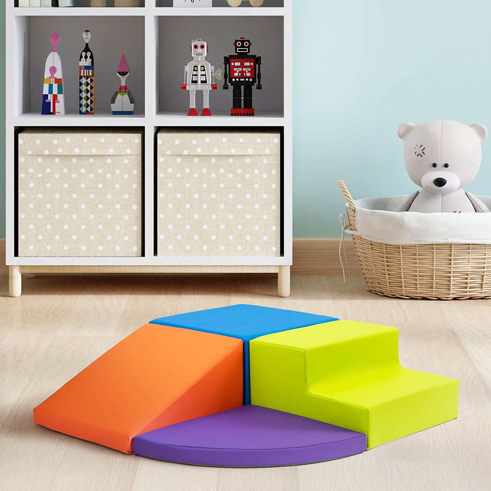 Colorful foam steps in a playroom with toys and storage units.