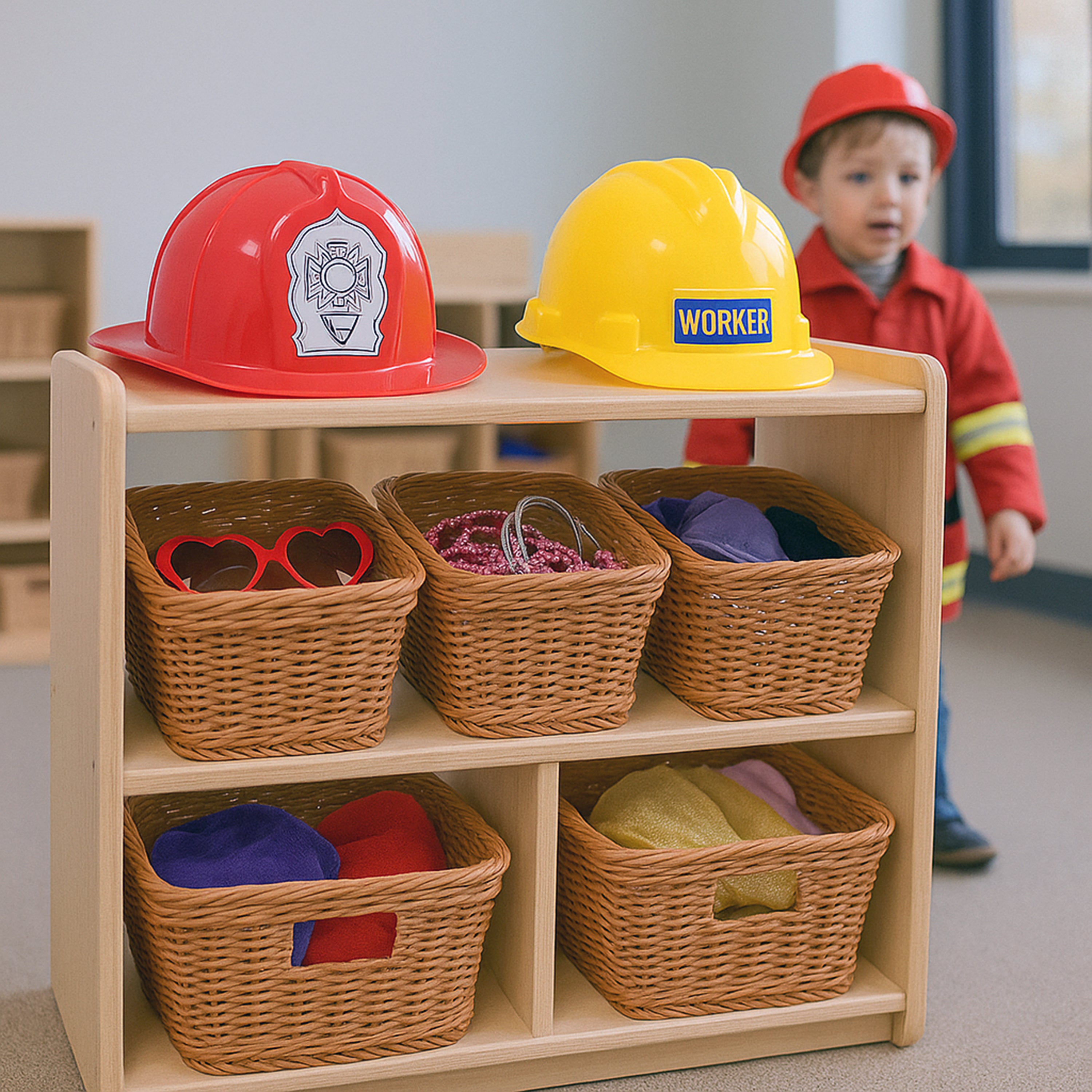 Children's playroom with a shelf displaying colorful hats and a child wearing a red helmet.