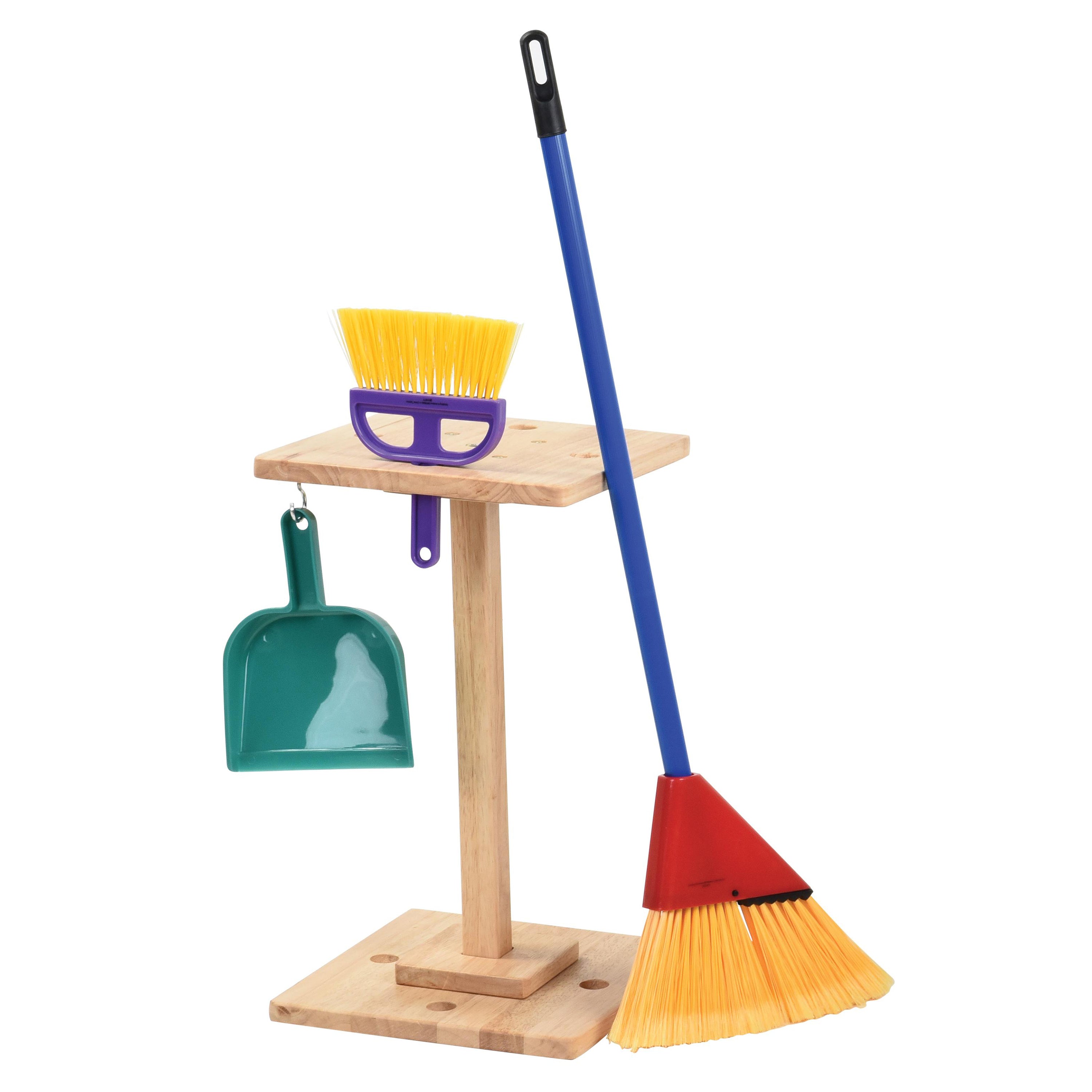 Children's broom, dustpan, and brush set on a wooden stand with a white background
