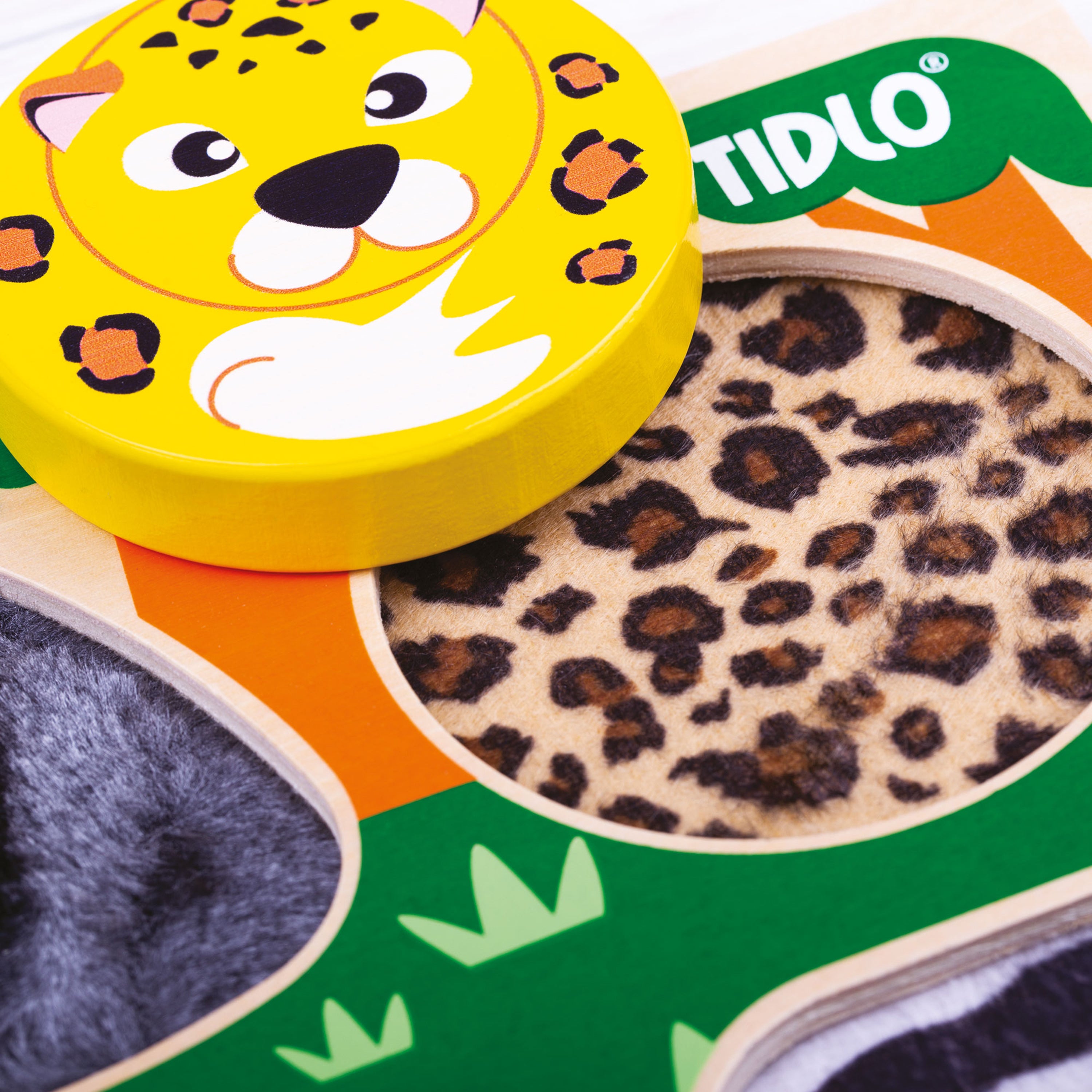 Toy packaging with a leopard print design and TIDLO branding.
