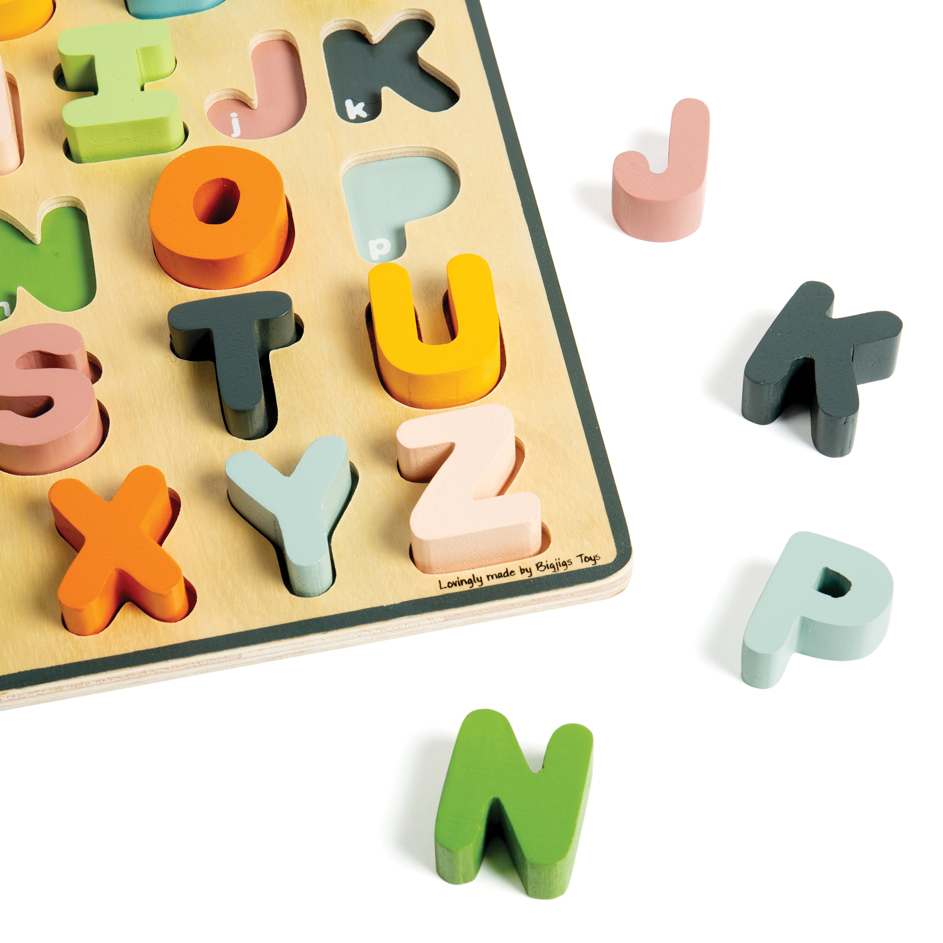 Colorful wooden alphabet puzzle on a white background