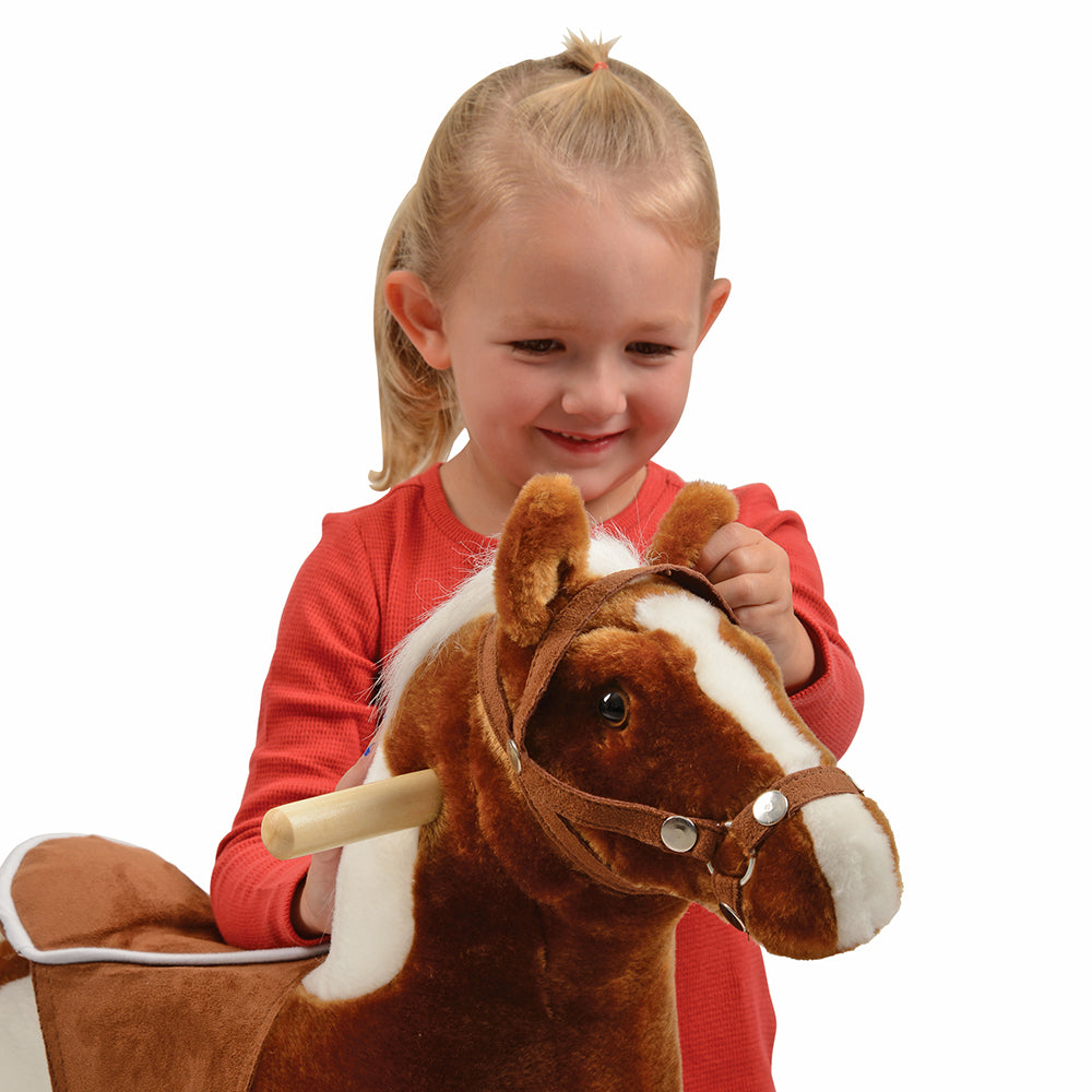 Toddler Interacting with Plush Pinto Rocking Horse with Sound