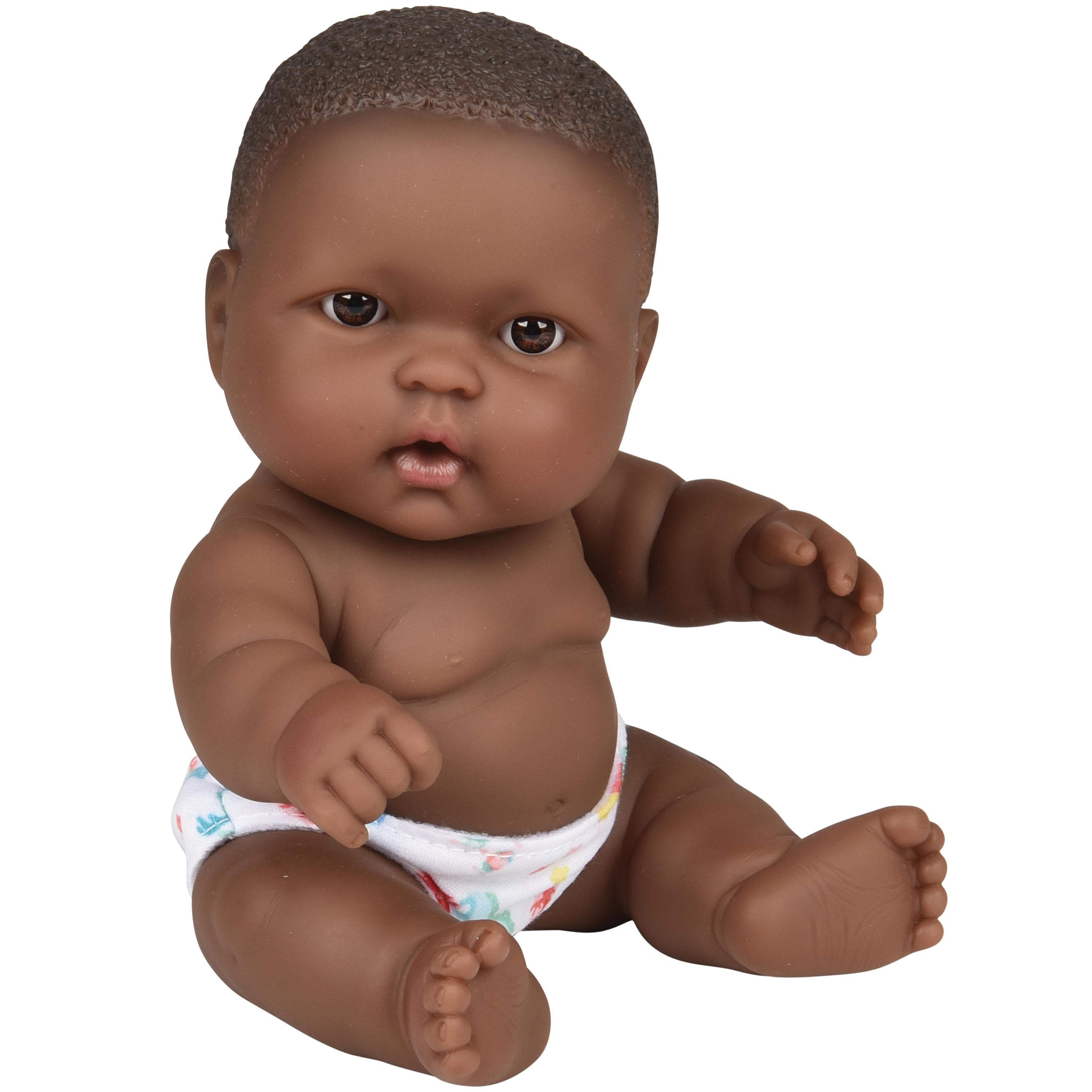 Doll with dark skin and short hair wearing a diaper on a white background