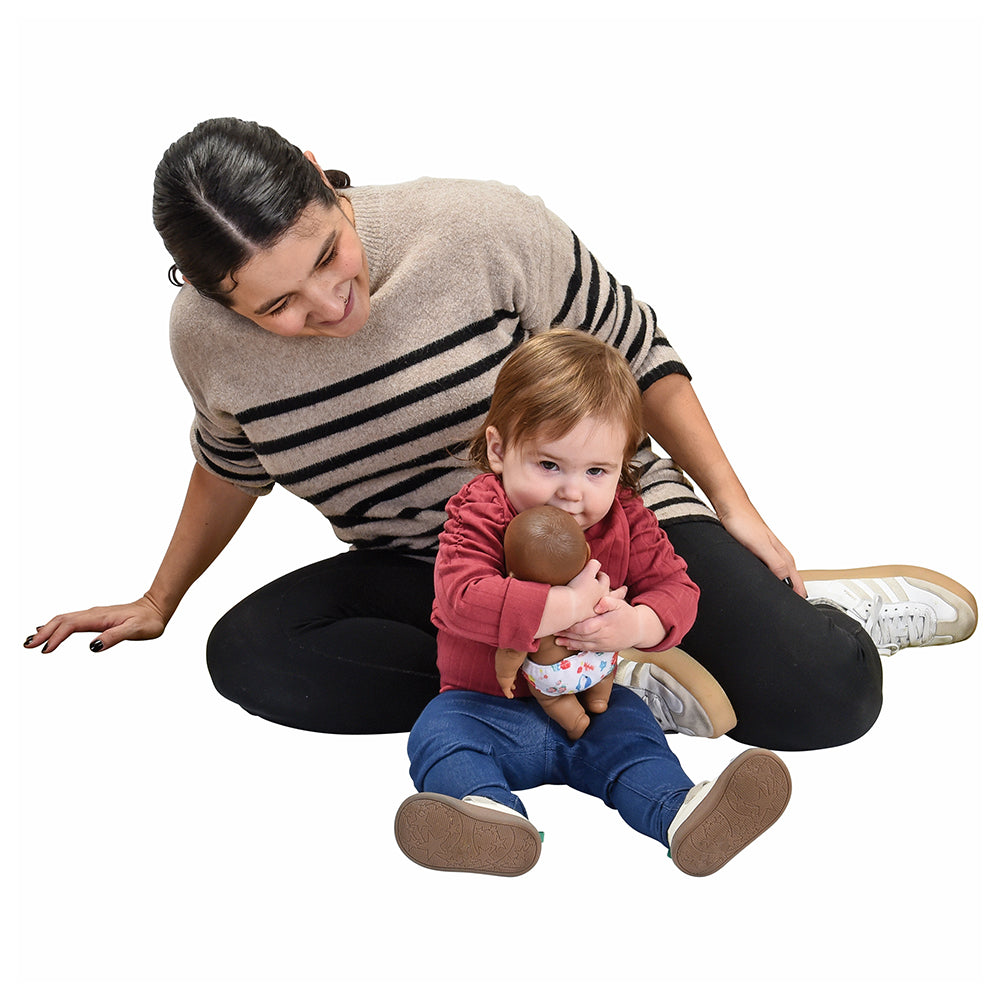 Toddler Playing with Huggable baby