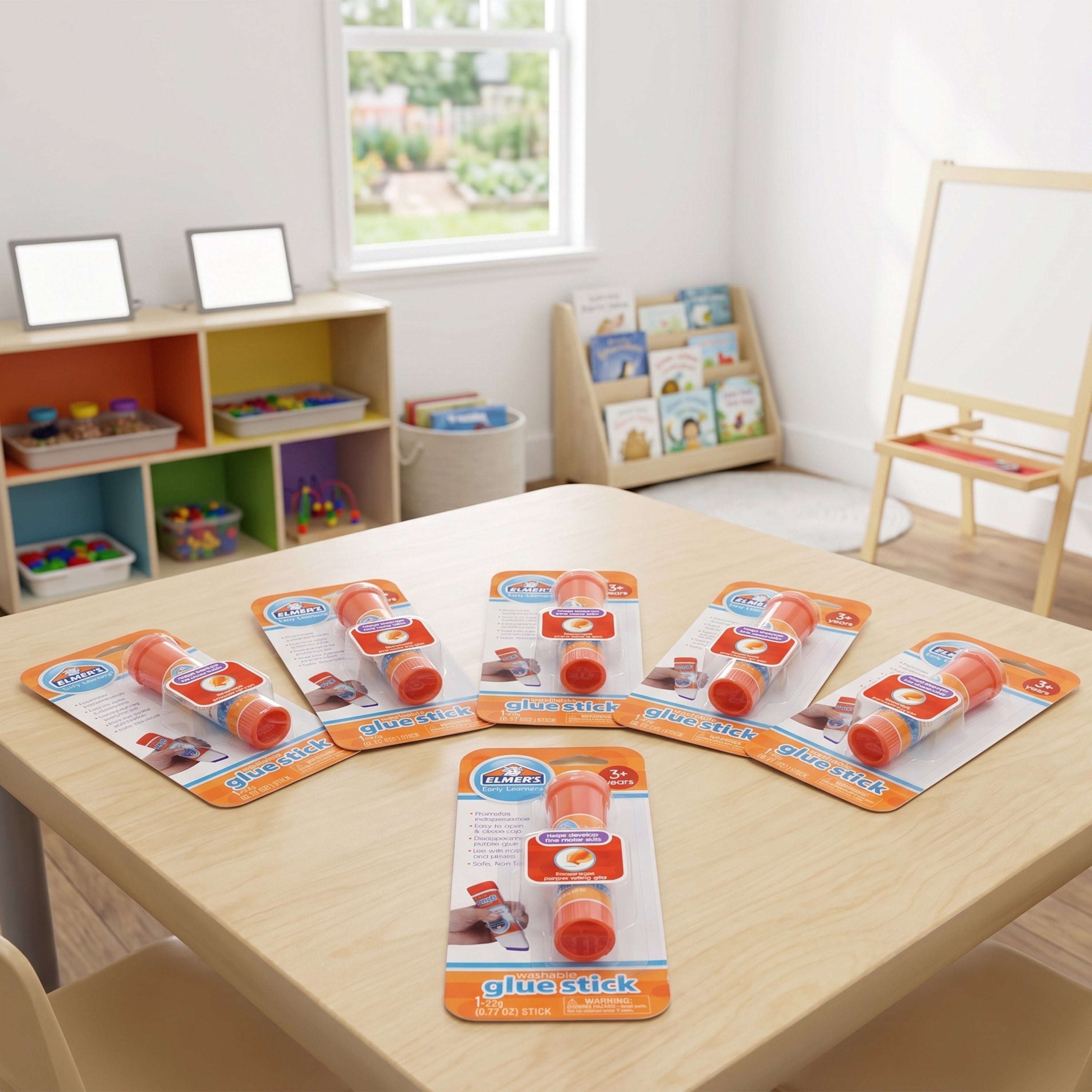 Packaged glue sticks on a table in a classroom setting