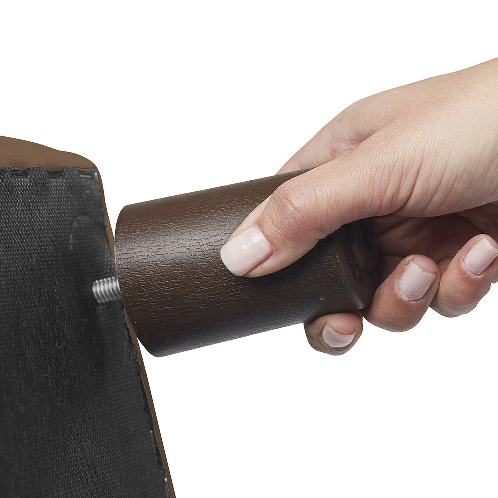 Hand screwing in leg on Little Lux Chocolate Preschool Sofa