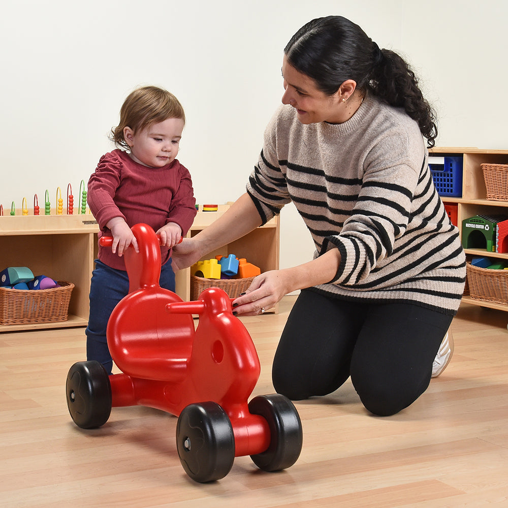 Toddler Playing with Push-N-Ride Pal  in the classroom