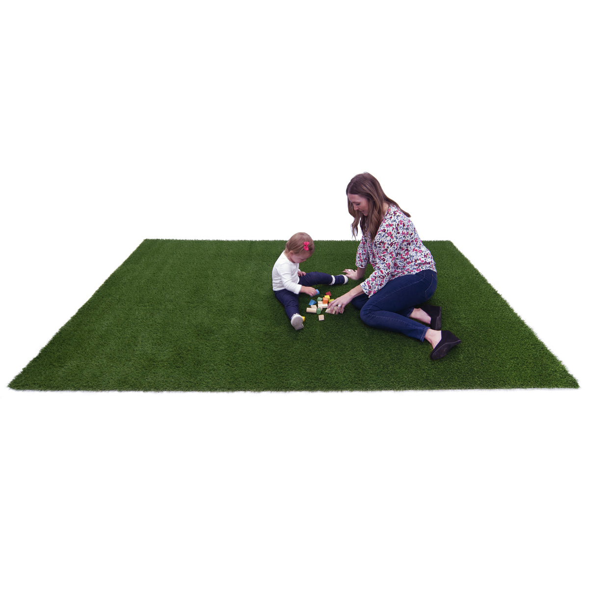 A rectangular green artificial turf mat on a white background, with a woman and child sitting on it and playing with small toys.