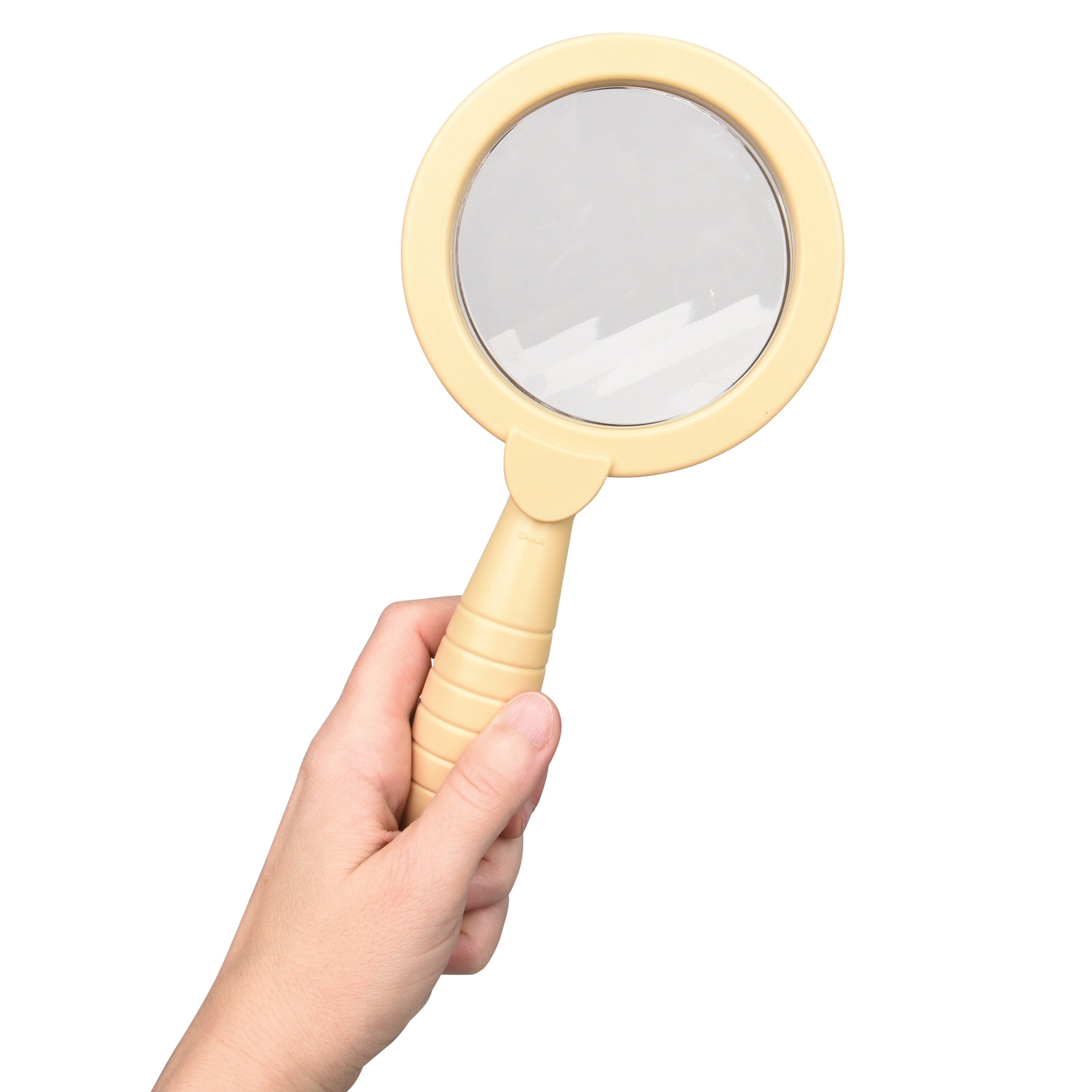 Hand holding a beige handheld mirror against a white background