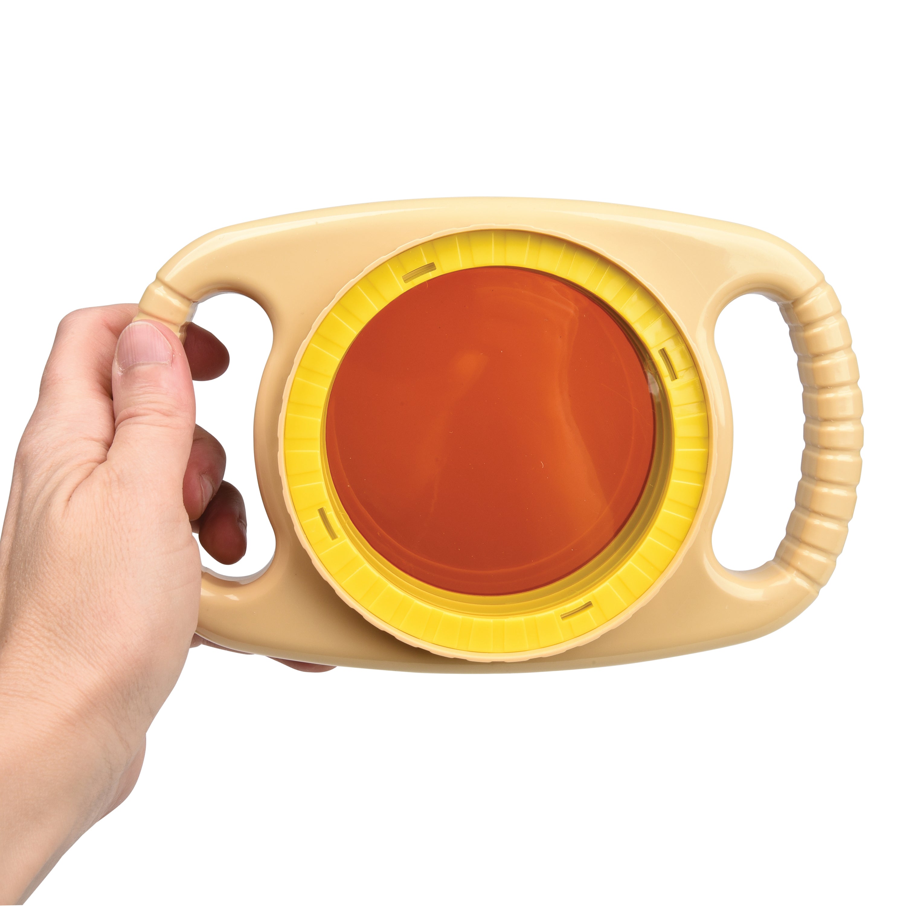 Hand holding a beige and yellow object with a red center on a white background