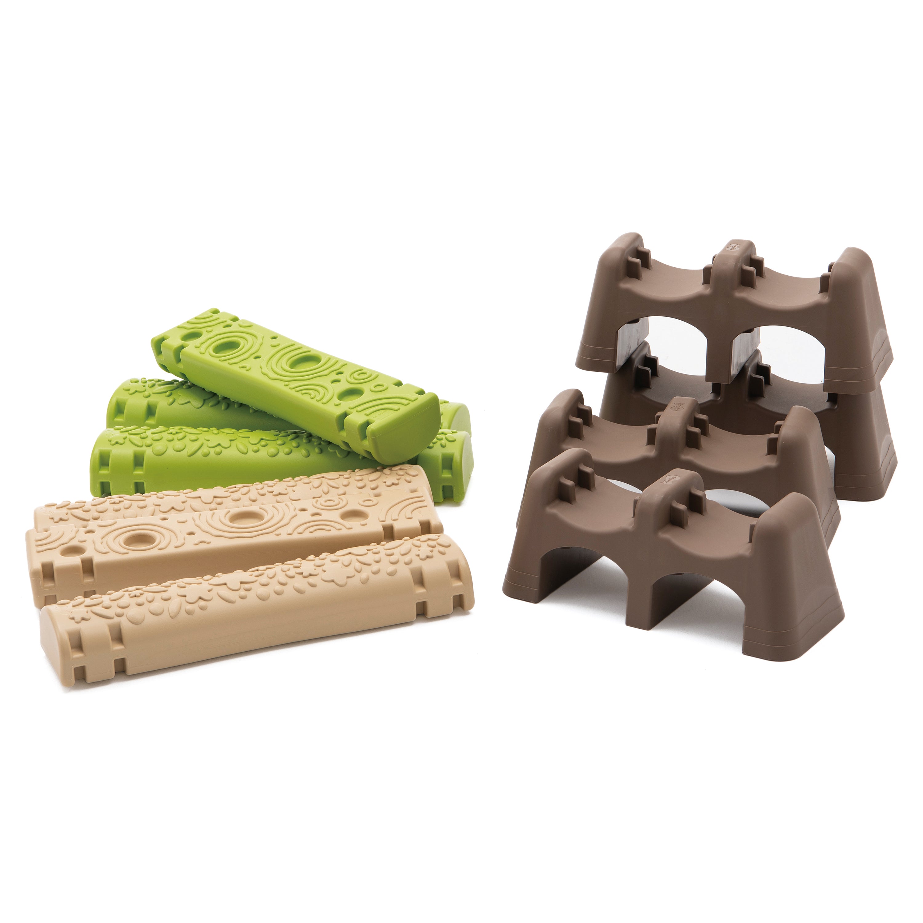 Set of green and beige plastic blocks on a white background