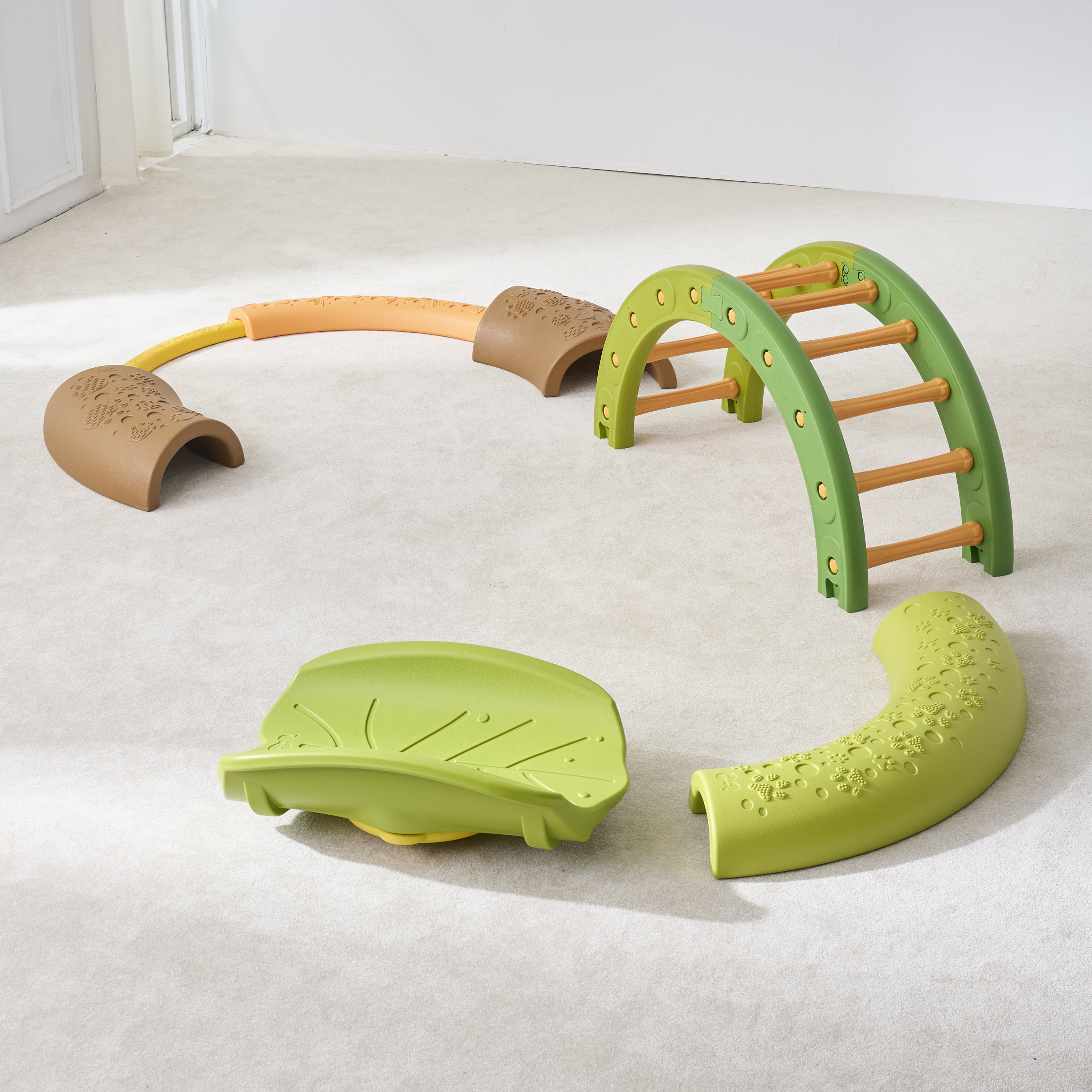 Children's playset with green and brown elements on a light gray floor.