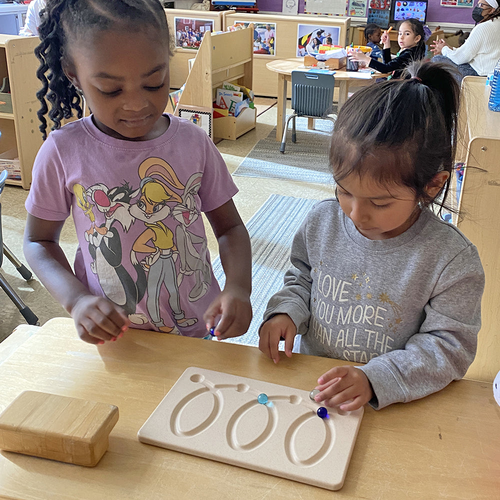 Kids Engaging with Wooden Breathing Board