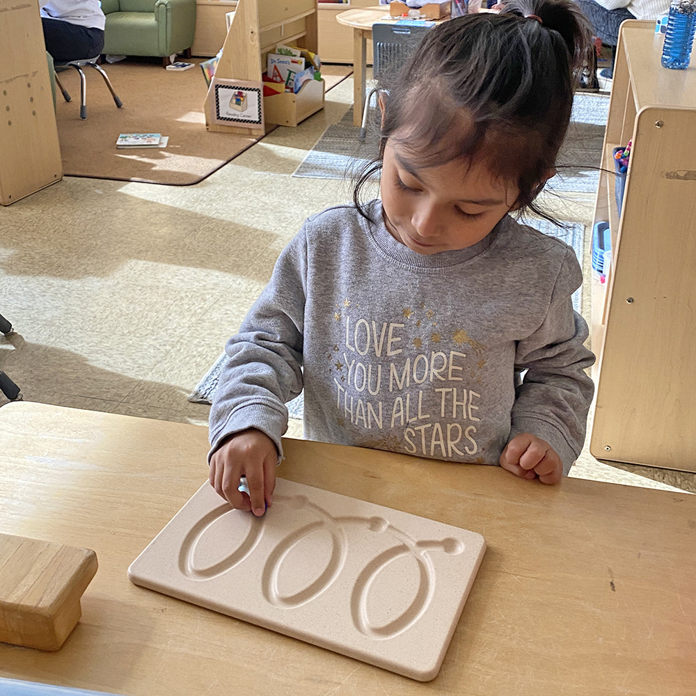 Kid Interacting with Wooden Breathing Board