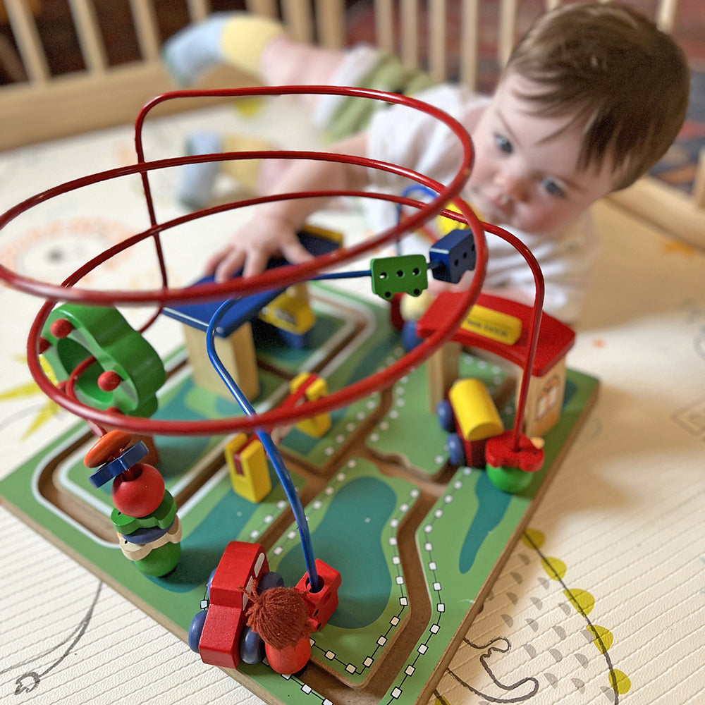 Toddler Interacting with City Adventure Bead Maze