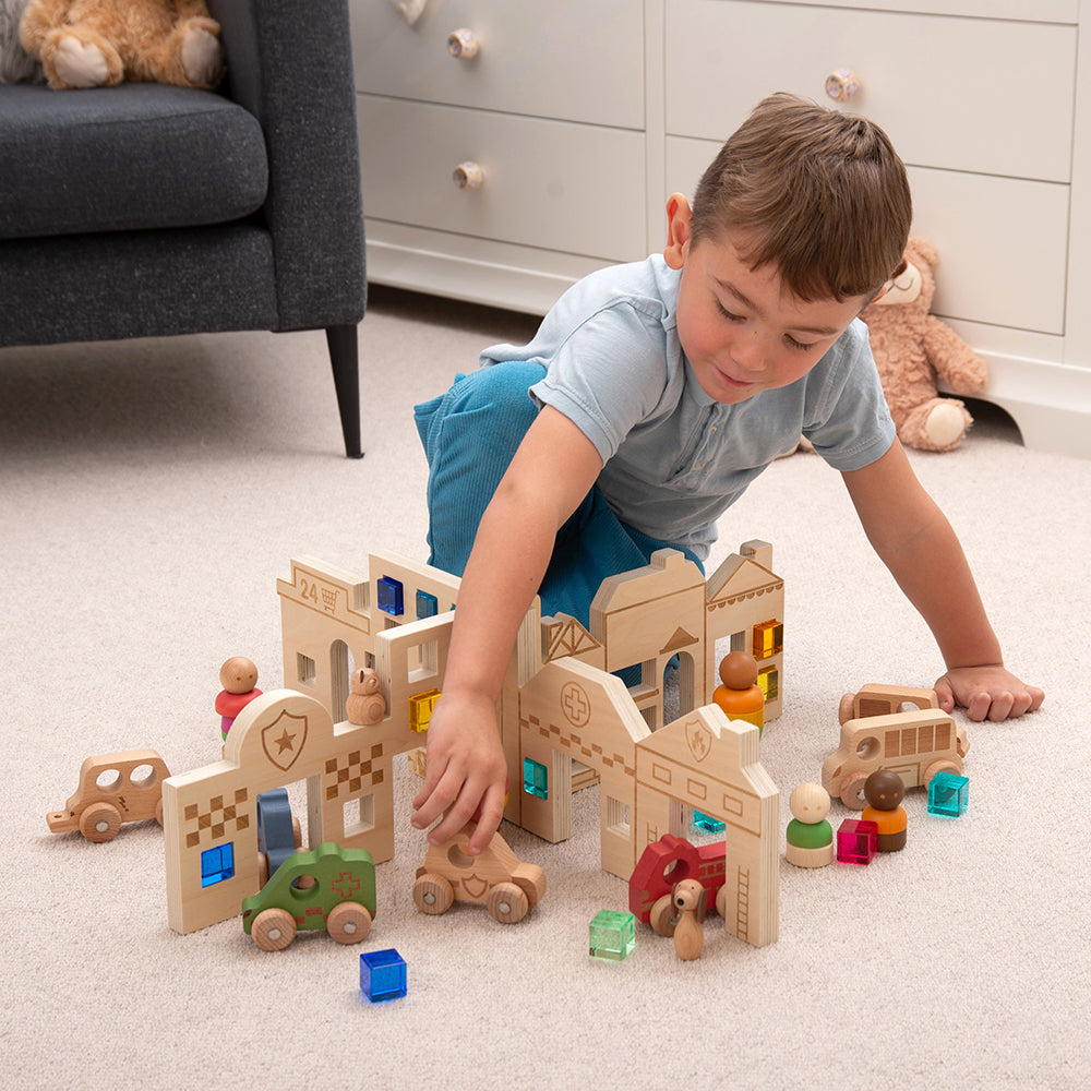 Kid Using Tactile Town Discovery Dividers with Other Block Accessories
