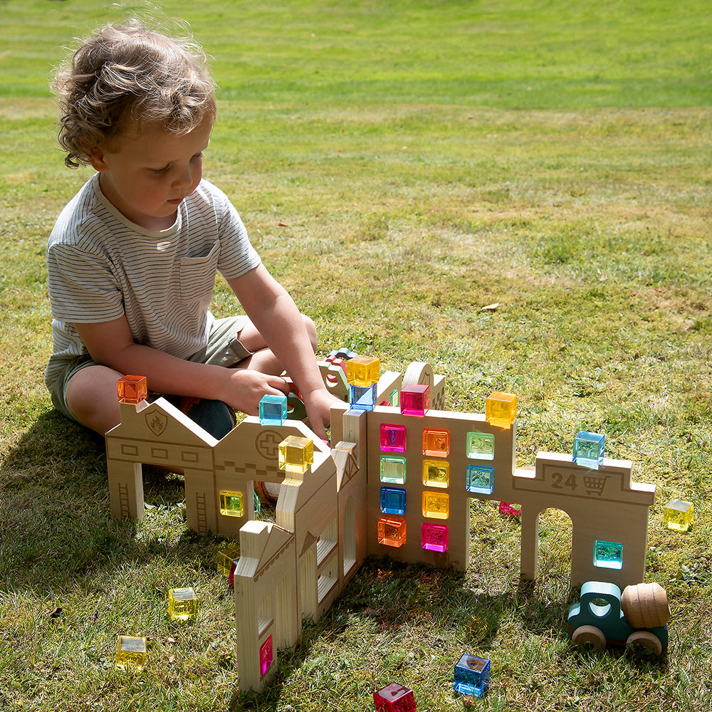 Kid Playing Outside with Tactile Town Discovery Dividers 