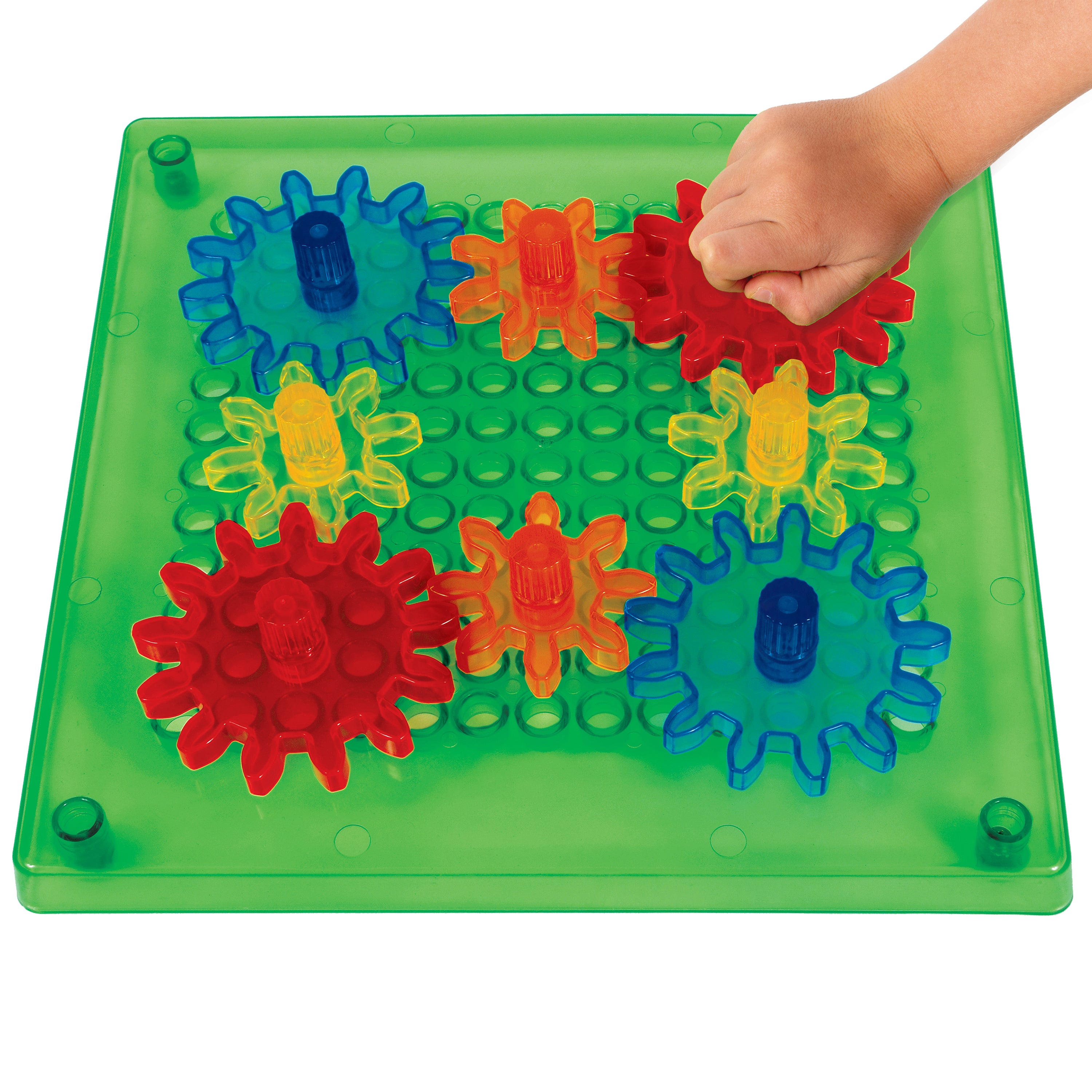 Colorful gear puzzle on a green baseplate with a hand interacting with it.