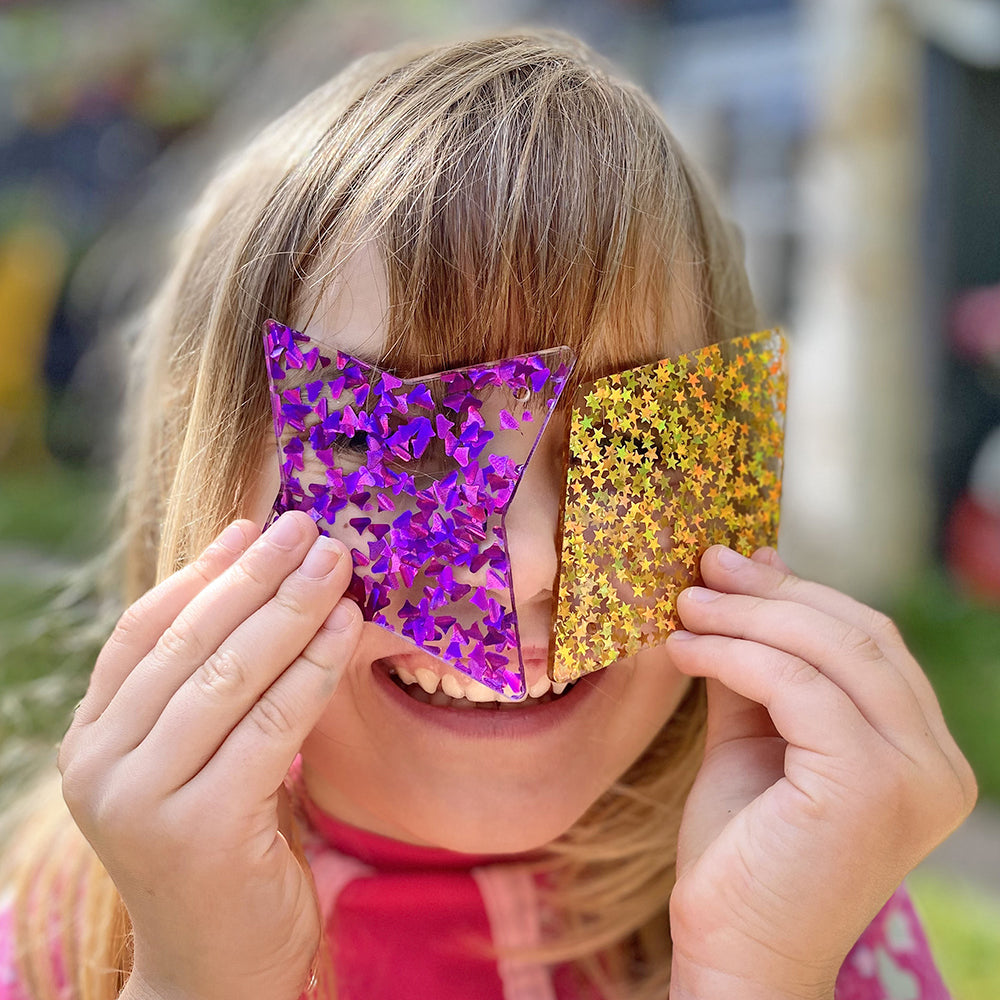 Kid Engaging with Glitter Panels