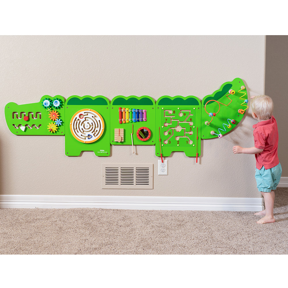 Toddler Engaging with Wall Panel