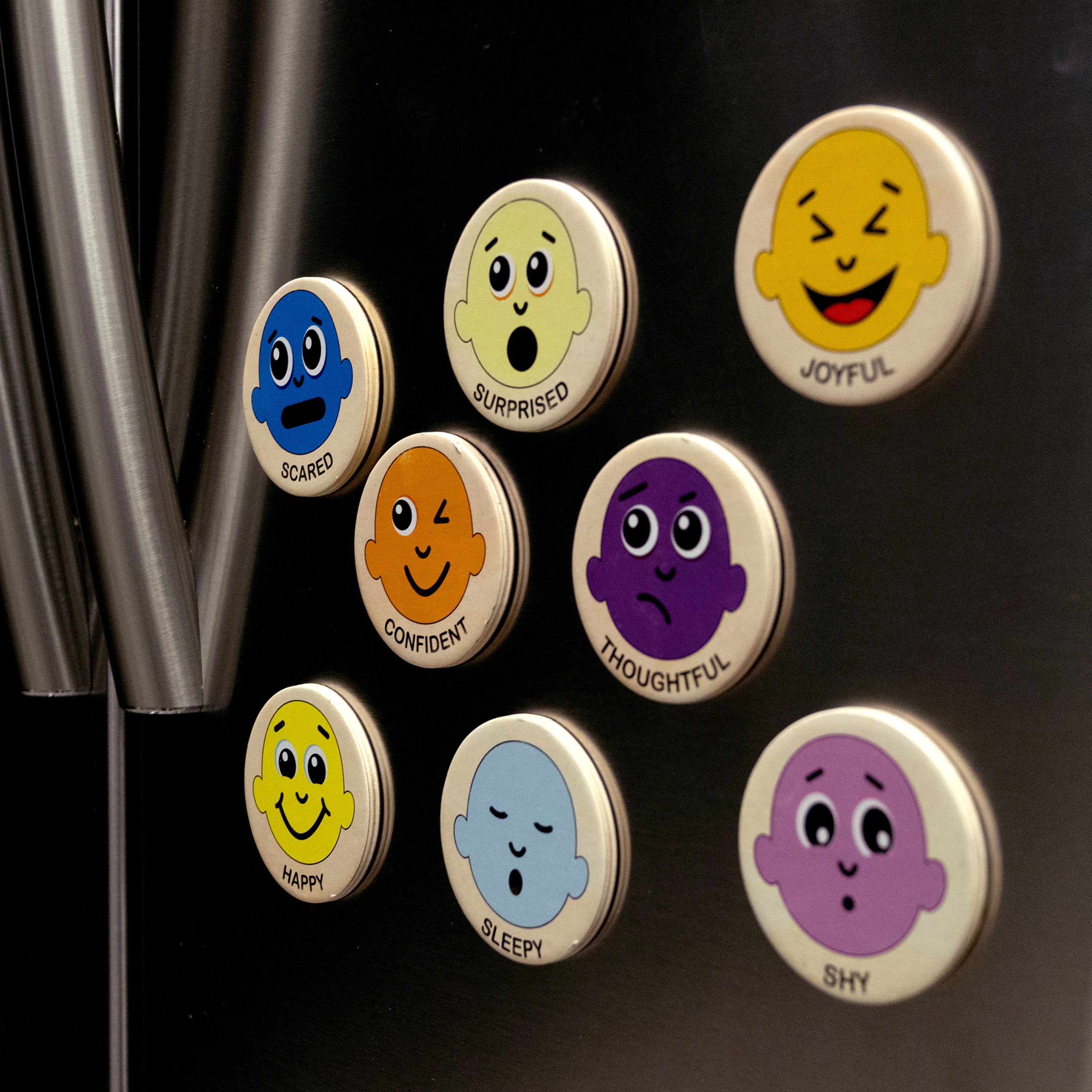 Emotion themed magnets on a metal refrigerator door